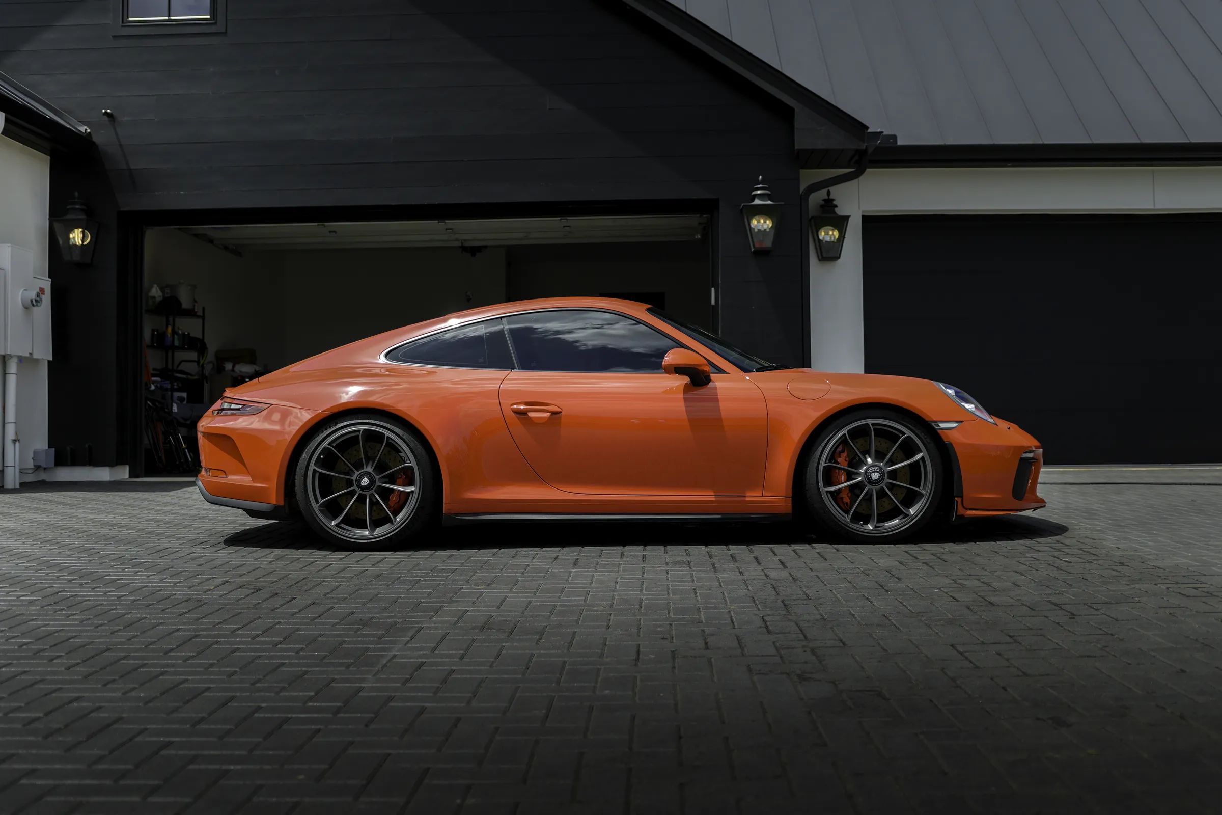 Orange Porsche 911 GT3 Touring in profile