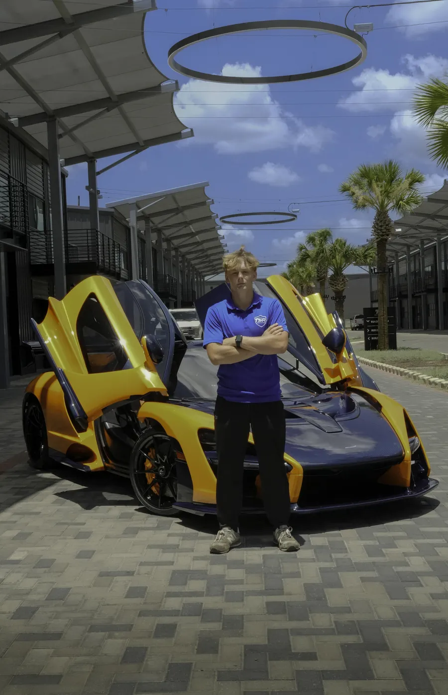 Tegan, founder of TSR Mobile Detailing, with a customer's McLaren